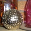 A decorative orb made form thumbtacks.
