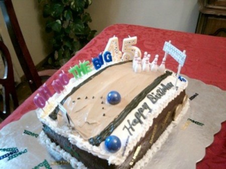 A birthday cake that resembles a bowling alley.