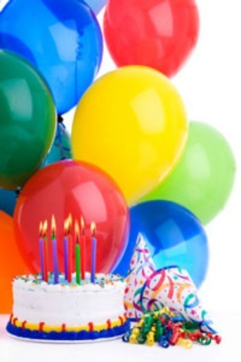 birthday balloons, hats and cake.