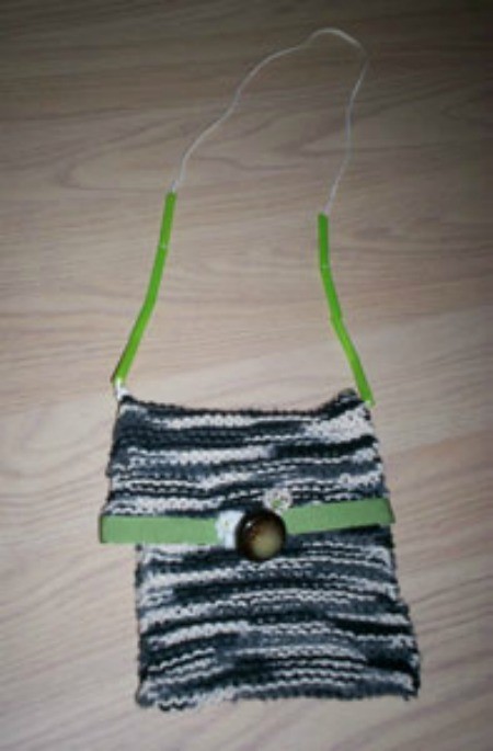 Small knit bag with strap.