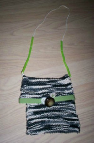 Small knit bag with strap.