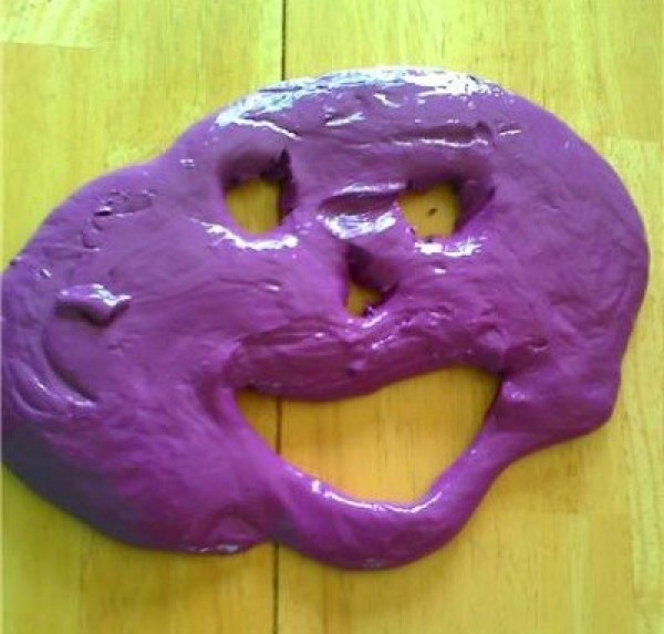 homemade purple silly putty in face shape