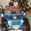 Girl in toy jeep