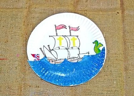sailing ship on the ocean painted on paper plate