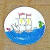 sailing ship on the ocean painted on paper plate