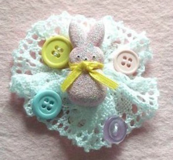 Pin with bunny and buttons on lace backing