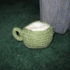 Sage green crochet coffee mug.