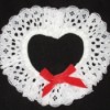 A lacy heart from white doilies, for a napkin rings.