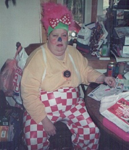 A woman dressed up as a clown.