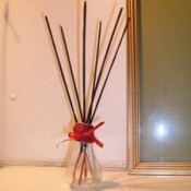 Several sticks of incense in a jar.