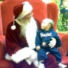 A baby in Santa's lap.