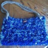 Blue denim crocheted purse.