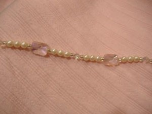 Pink bead and faux pearl necklace.