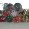 Rolled hay bales decorated for fall and Halloween.