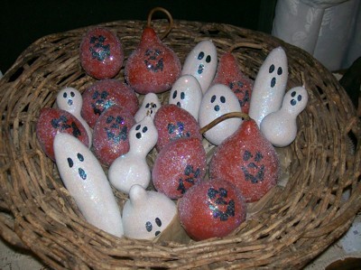 white and orange gourd ghouls in basket