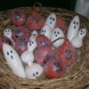 white and orange gourd ghouls in basket