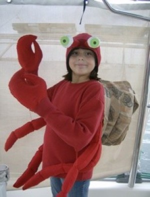 Girl wearing a hermit crab costume.
