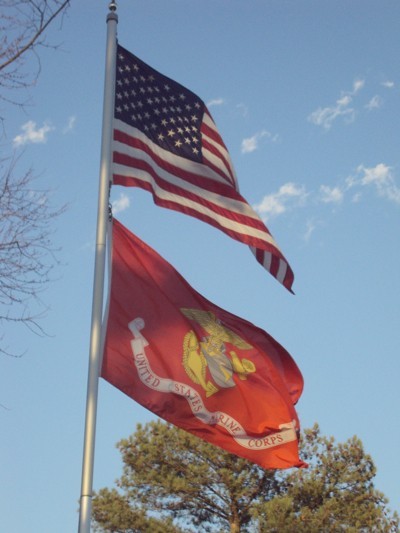 US Flag and US Marine Corps flag flying.