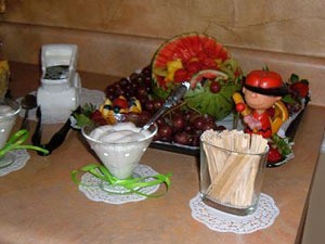 A cute baby carriage fruit tray for a baby shower.