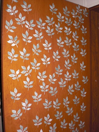 Door decorated with peel and stick leaves.