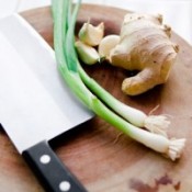 cutting board, knifeginger and scallions