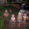 Photo of kids after playing in the mud.
