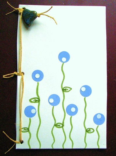 Decorative cover on homemade notepad.