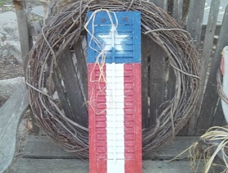 Flag Painted Shutters - finished shutters in front of a natural twig wreath