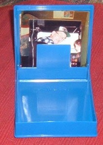 Blue floppy disc case with photo inside.
