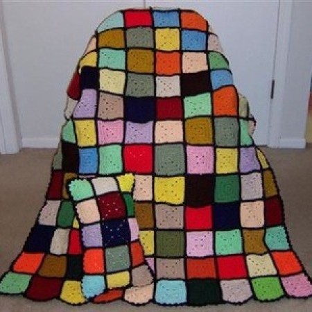 Multicolored block afghan and pillow.