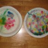 Paper plates with raindrop color splatters