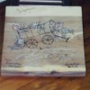 wood burned covered wagon and floral plaque