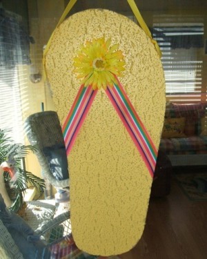 yellow decorative flip flop made from ceiling tile