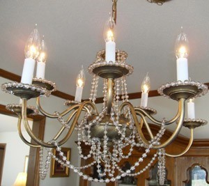 Chandelier hung with beads.