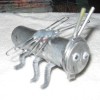 A silver ant made from recycled materials.