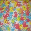 blue, yellow, and red handprints on paper