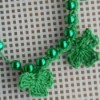 shamrocks crocheted onto plastic bead necklace