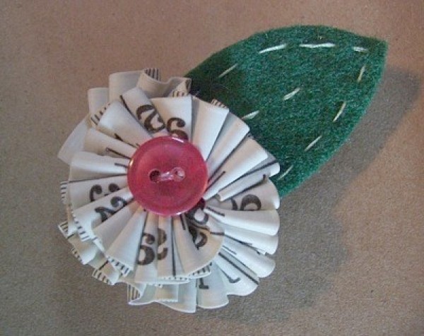 Flower pin or magnet made with a sewing tape measure.
