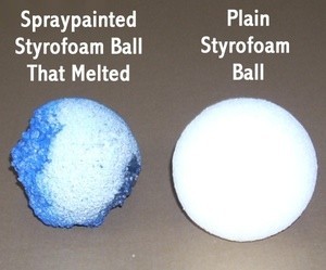 Two Styrofoam balls, one painted and melted and one unpainted.