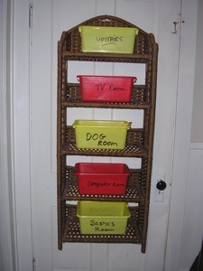 A clutter organizer hanging on a door.