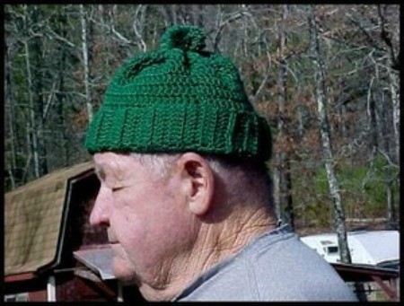 man wearing a green ski hat