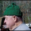 man wearing a green ski hat