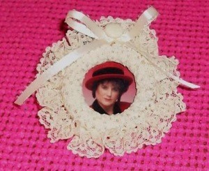 Photo frame with lace edging.