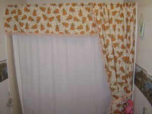 Homemade shower curtain with fall motif.