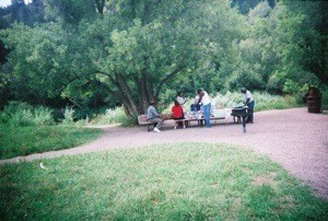 family at picnic table in park