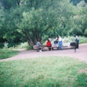 family at picnic table in park