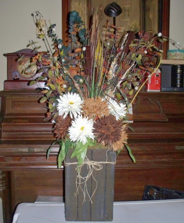 A decorative vase that appears to be made of wood.