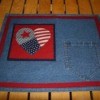 Pocketed placemat with patchwork heart design.