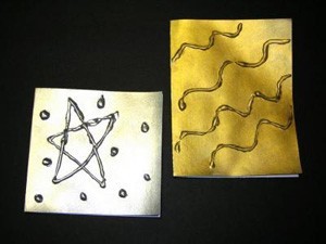 Metalic paper note cards, gold and silver.