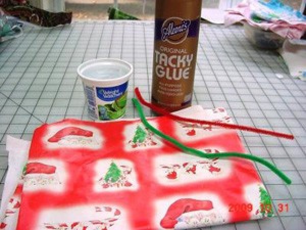 Supplies for making Christmas treat cups.